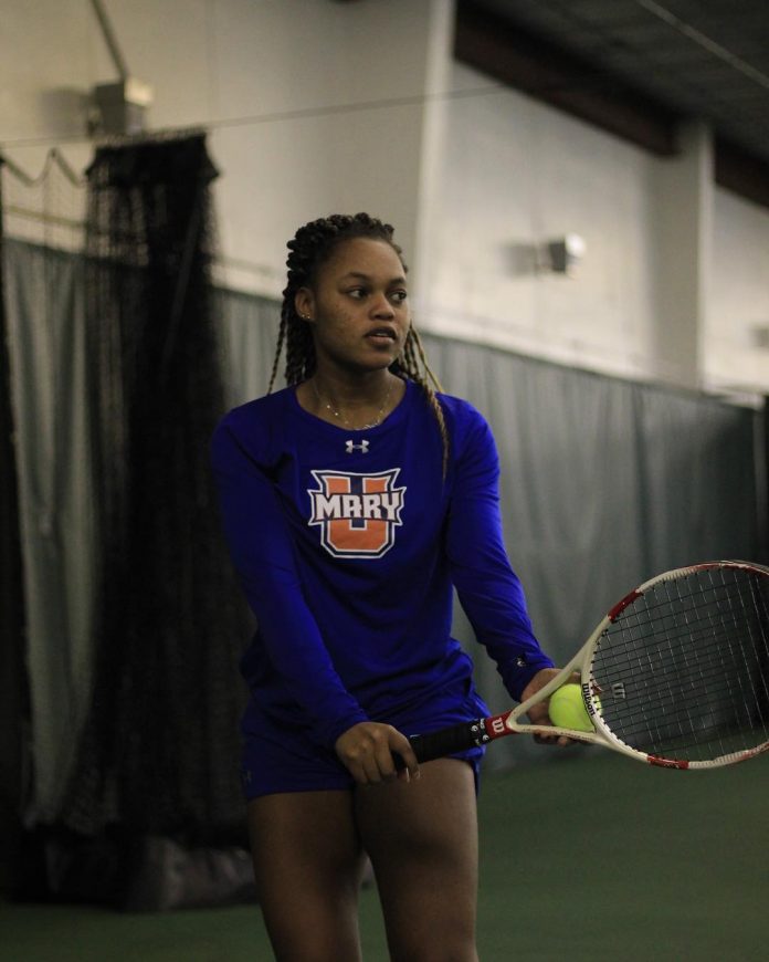 Tasha Dembo prepares to serve during a Marauders match in 2019