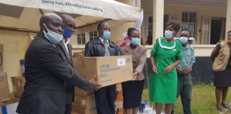 Manicaland ZRCS provincial manager Munyaradzi Chikukwa hands over the PPEs to be used at the Victoria Chitepo Hospital in Mutare, Manicaland recently