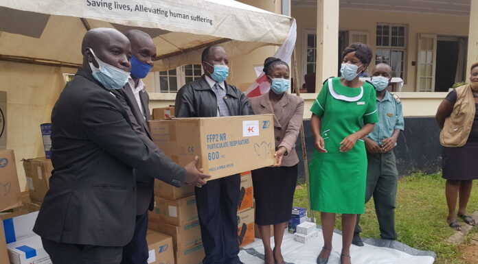 Manicaland ZRCS provincial manager Munyaradzi Chikukwa hands over the PPEs to be used at the Victoria Chitepo Hospital in Mutare, Manicaland recently