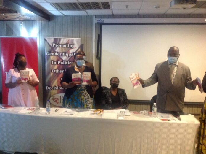 WhatsApp Image 2020 12 01 at 09.18.43 MDC Alliance secretary for international relations Gladys Hlatywayo holds the Gender Audit Report of Main Political Parties Zimbabwe and Model Gender Policy together with Zanu-PF women’s league chairperson Mabel Chinomona and MDC-T's Gift Chimanikire while Zimbabwe Gender Commission chairperson Margret Mukahanana-Sangarwe looks on