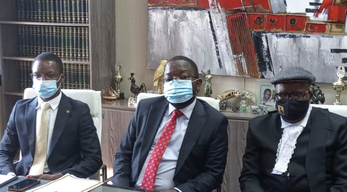 Advocate Thabani Mpofu flanked lawyer Tendai Biti and Dr Musa Kika during a press conference in Harare