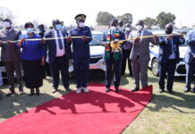 President Mnangagwa commissions the latest ZRP vehicle fleet while Commissioner General Godwin Matanga and some senior government officials look on