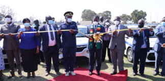 President Mnangagwa commissions the latest ZRP vehicle fleet while Commissioner General Godwin Matanga and some senior government officials look on