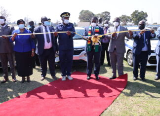 President Mnangagwa commissions the latest ZRP vehicle fleet while Commissioner General Godwin Matanga and some senior government officials look on