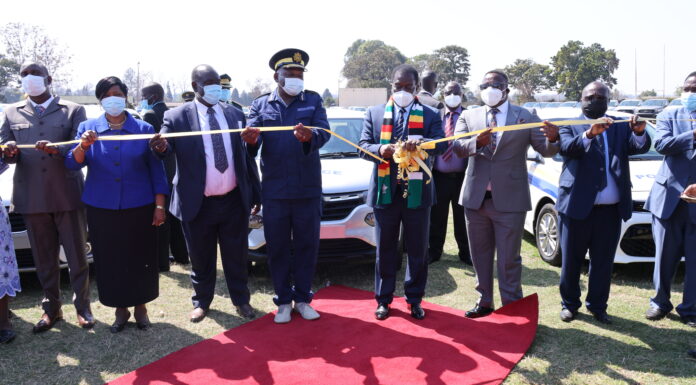 President Mnangagwa commissions the latest ZRP vehicle fleet while Commissioner General Godwin Matanga and some senior government officials look on