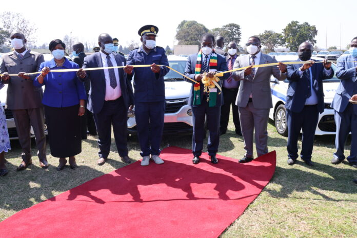 President Mnangagwa commissions the latest ZRP vehicle fleet while Commissioner General Godwin Matanga and some senior government officials look on