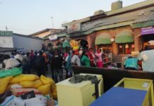 Vendors and other residents from Karoi mingle in front of the building that was gutted in yet another fire incident in Karoi. Mashonaland West has recorded an increased number of fire incidents during this year's fire season