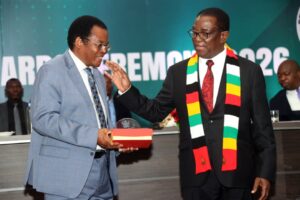 Dr Gift Machengete (Left), receives award from President Mnangagwa